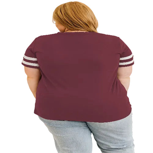 Person wearing a maroon t-shirt