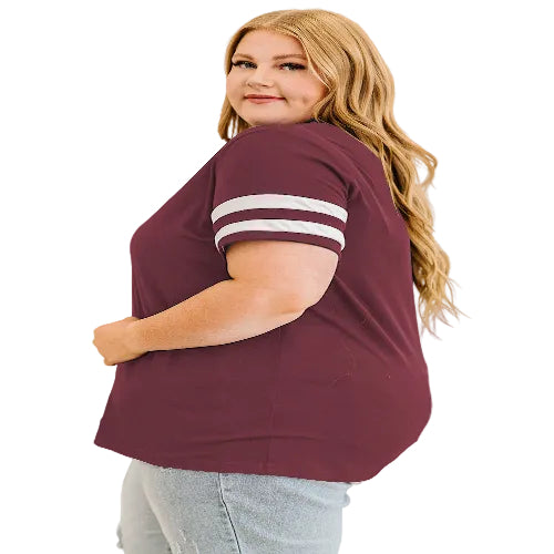 Woman wearing maroon t-shirt with white stripes